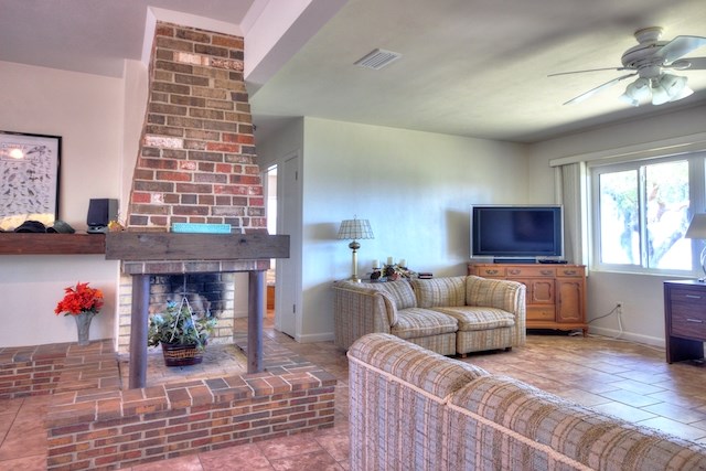 Brick Fireplace between Entry and Living Area